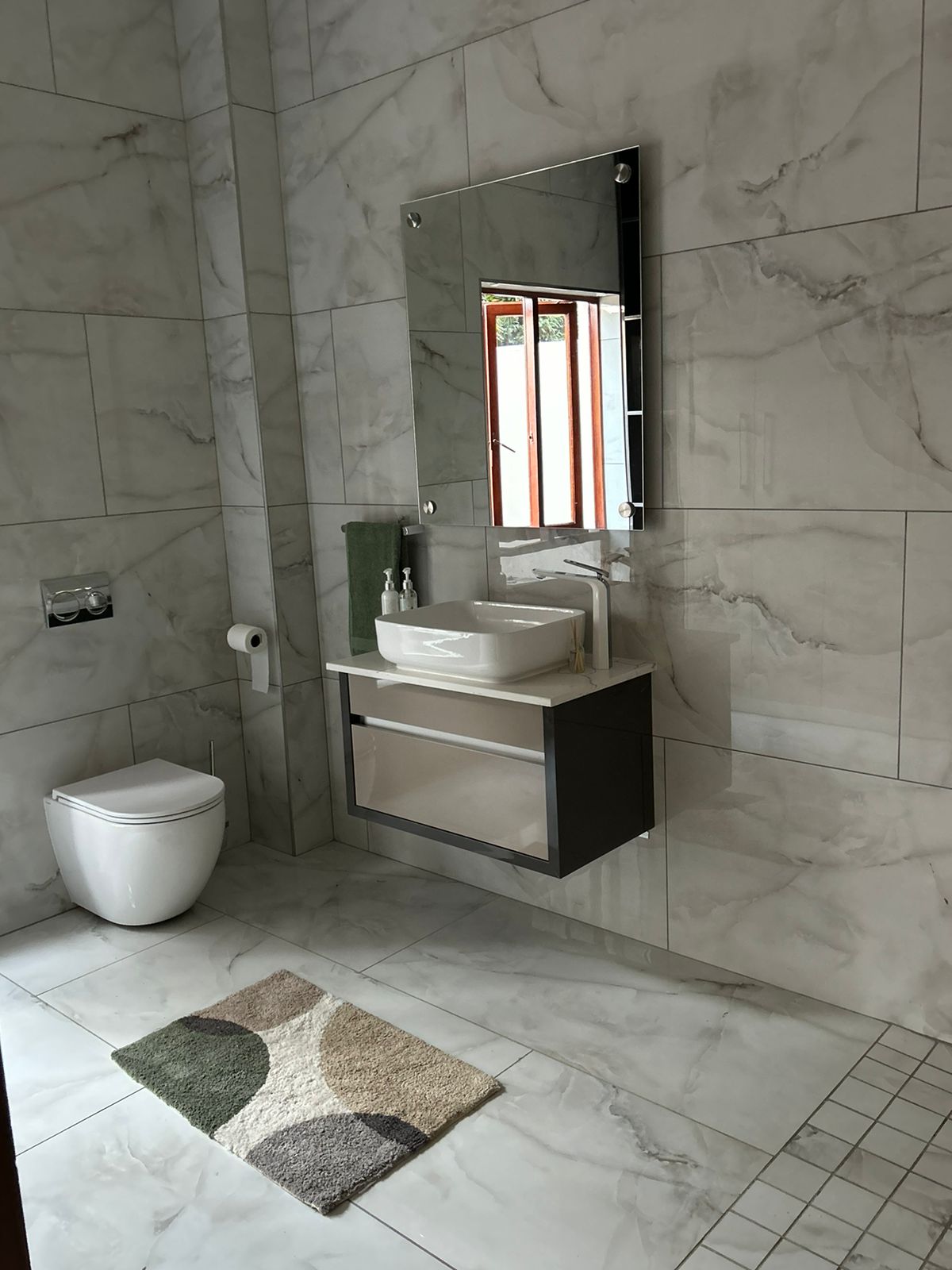 Marble Guest Bathroom with Floating Vanity