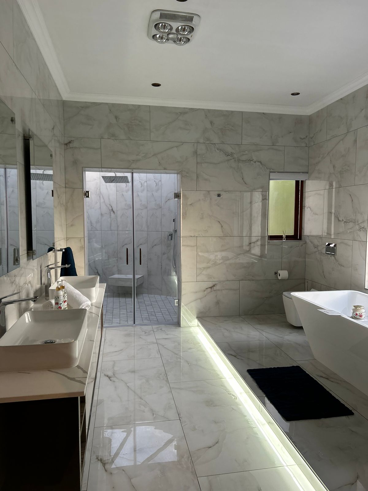 Marble Bathroom with Frameless Glass Shower