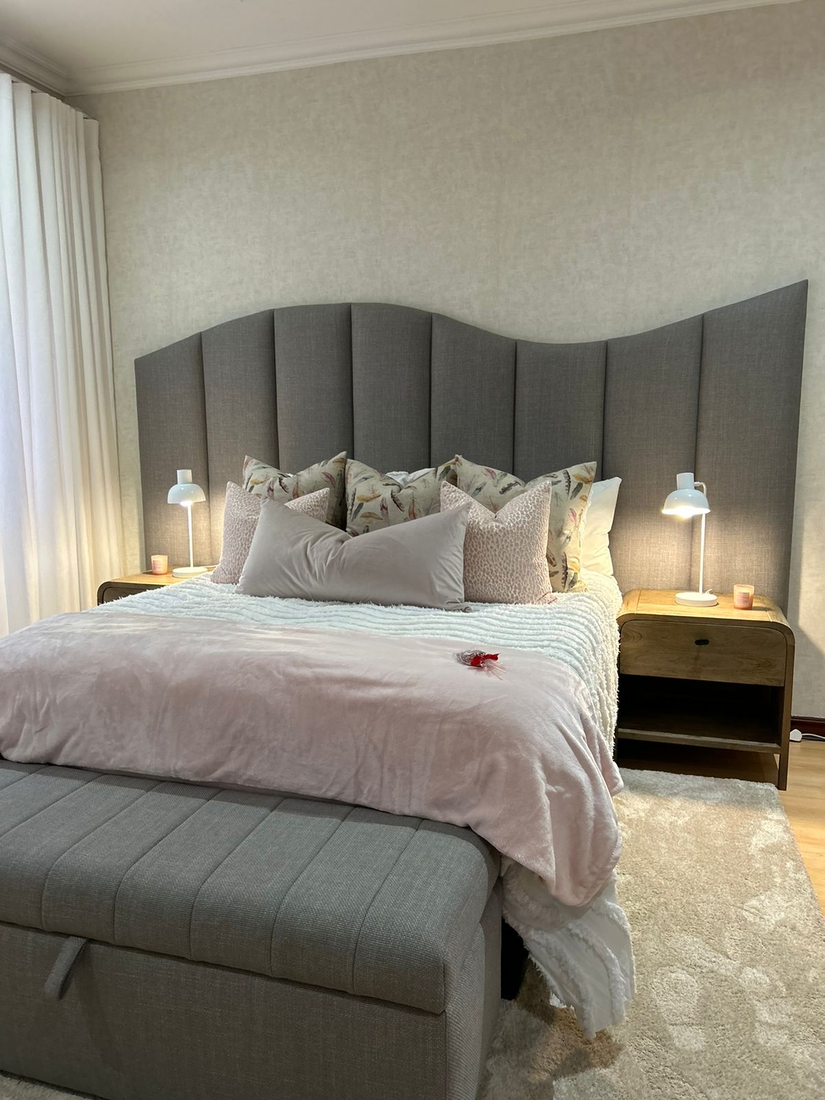 Curved Grey Headboard & Soft Pink Linens