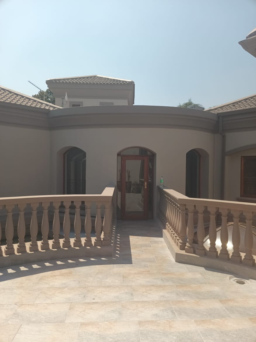 Curved Upper Courtyard & Arched Entry Doors
